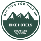 Rundes Abzeichen mit Bergsilhouette und Schladming Dachstein Bike Hotels
