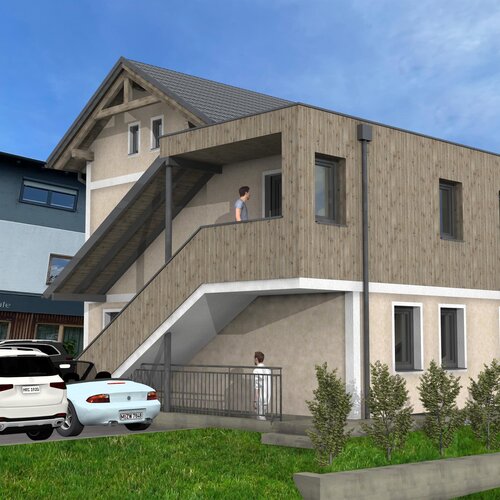 Zweistöckiges Gebäude mit holzverkleidetem Anbau und Balkon, Restaurantbeschilderung sichtbar.